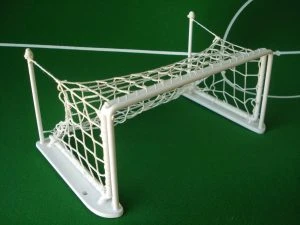 A white Subbuteo goal with net